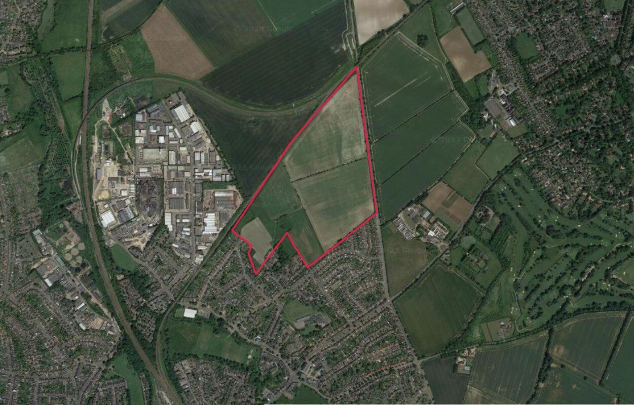 Aerial image of a plot of land, outlined in red.